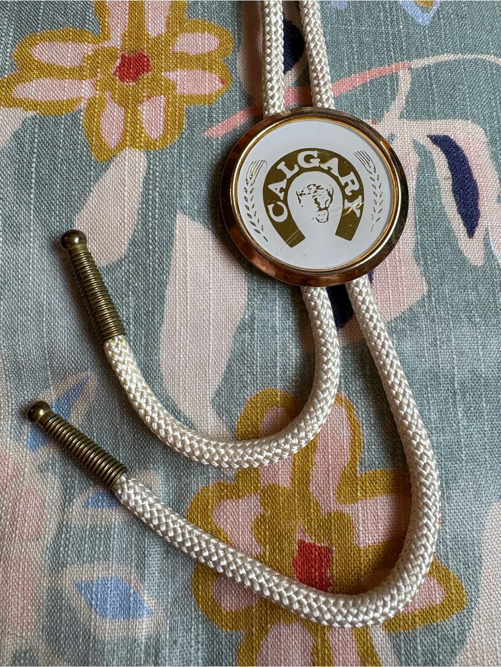 Vintage Calgary Bolo Tie | White Cord | Gold Tone